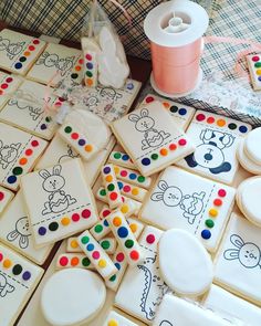 some decorated cookies are sitting on a table