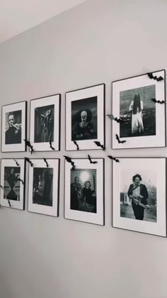 black and white photographs hanging on the wall