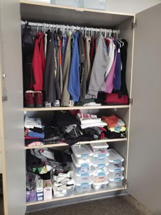 the closet is full of clothes and other items