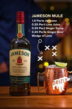 a bottle of jameson next to a copper mug