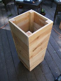 a wooden box sitting on top of a hard wood floor