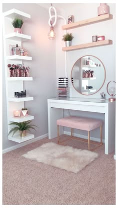 a white desk with shelves and a mirror on it in front of a pink rug