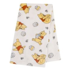 The oh-so-soft Winnie the Pooh Blanket will be a favorite for your baby to cuddle! The blanket features an allover print of Winnie the Pooh and his honey pot on a buttery ivory background. Measuring 30" x 36", this is the perfect size for use in the nursery or to take on the go. Made from easy care 100% polyester plush fabric, machine washable. The neutral unisex design makes this a great shower gift for baby boys and girls alike at a great value! Coordinates with the Disney Winnie the Pooh Infa Disney Baby Nurseries, Winnie The Pooh Blanket, Pooh Plush, Plush Baby Blankets, Winnie The Pooh Plush, Ivory Background, Infant Girl, Baby On The Way, Honey Pot