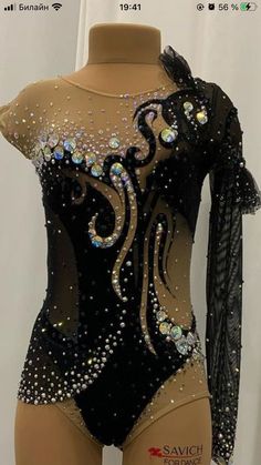 a mannequin wearing a bodysuit with sequins on it