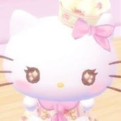 the hello kitty doll is wearing a tiara and dress with bows on it's head