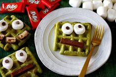 some waffles with googly eyes on them and marshmallows in the background