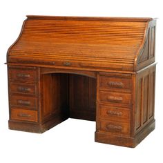 an old fashioned wooden desk with drawers