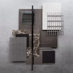 an assortment of different materials are arranged on the wall, including tiles and metal bars