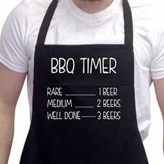 a man wearing an apron with the words bbq timer written in white on it