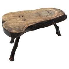 an old wooden bench with metal legs and holes in the wood, isolated against a white background