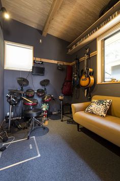 a living room filled with furniture and musical instruments