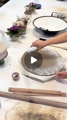 a person is making some food on a table