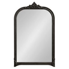 an ornate black framed mirror on a white background