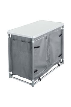 a white table with two grey bags on it