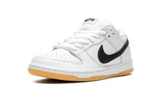 The Nike SB Dunk Low “White/Gum” is a timeless colorway of the retro skate shoe.  Dubbed simply “White/Gum” by Nike SB, this Dunk Low features a versatile white-and-black color block on its design.  Specifically, the shoe is constructed with a white leather upper.  A black leather Swoosh appears on either side of the shoe and black “Nike” branding is embroidered on the heel.  Classic “Nike SB Dunk” detailing is found on the tongue tag.  A white midsole and gum rubber outsole complete the look. White Nike Skate Shoes, Nike White Skate Shoes For Streetwear, Nike Sb Low Dunks, Off White X Nike Dunk Low, Mike Sb Dunk Low, Nike Sb White, Sneaker Wishlist, Nike Sb Dunk Low Black White, Sb Nike