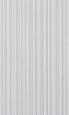 a white wall with vertical lines painted on it