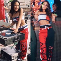 two women in matching outfits standing next to an old record player and dj's turntable