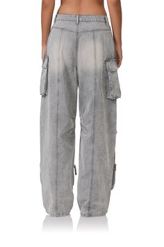 The clean lines of the wide-leg Parker cargo pants are enhanced by a high-waist design and relaxed fit. Street style cargo pocket details and back seaming make her your new go-to pants. Smoke Grey Wash Rigid denim High rise Wide leg Cargo pocket detail Back seaming Zip front closure 8 pocket styling Denim: 100% Cotton Machine wash cold, gentle cycle, do not bleach, line dry, cool iron if needed. Model is 5'9 and wears a size 24.  Front rise 12.5 in. Leg opening 19.75 in. Inseam 34 in. Street Style Cargo, Baggy Cargo Pants, Style Cargo, Cargo Pocket, Grey Wash, Cargo Pant, Catsuit, Pocket Detail, Clean Lines