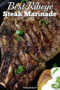 steak marinade on a plate with sour cream and green onion garnishes