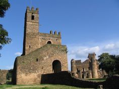 an old stone castle with a clock tower