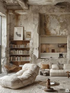 a living room filled with furniture and bookshelves next to an open window on the wall