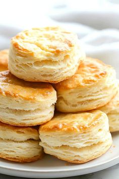 a stack of biscuits sitting on top of a white plate