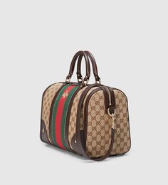 Description Our medium Vintage Web top handle in our Original GG canvas with Web and bee embroidery detail. The shoulder strap is adjustable and detachable. Size: 13″W x 9″H x 7″D / W33cm x H22.5cm x D18cm 100% genuine materials, matching the quality of the Gucci product (imported from Europe); Beige/ebony Original GG canvas with dark brown leather detail Green and red nylon Web and bee embroidery detail Interior zip and smart phone pockets Double handles with 4.3 in drop Adjustable and detachable shoulder strap with 14 in drop Zip-top closure Medium size Cotton linen lining Comes with dust bag, ation cards, and pamphlets 1:1 mirror image qualityDelivery 5-8 or 10-15 working days Please note that during high season and Sale period, delivery times may be affected We accept payment with a Cr Web Top, Clothes Model, Bee Embroidery, Bags Gucci, Gucci Vintage, Leather Detail, Trending Handbag, Embroidered Bag, Money Bag