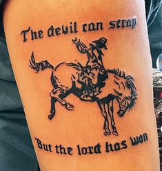 a man with a tattoo on his arm that says, the devil ran straw but the lord has won