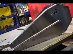 a metal object being worked on in a factory