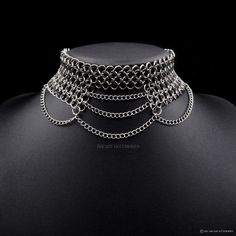 Handcrafted Stainless Steel Chainmail Choker This unique statement piece, features an open bottom half, connected by cascading chains. The chains bridge the open side and add an edgy touch by connecting the sides. This choker is an eye-catching accessory that adds a layer of sophistication & style to any outfit. Made from superior quality stainless steel, our products are durable, resilient and allergy friendly.  We also offer a lifetime repair warranty! *Terms & Conditions Apply Our unique fini Chainmail Choker, Chainmaille Jewelry Patterns, Chainmail Patterns, Chainmail Jewelry, Chain Maille Jewelry, Chain Mail, Fantasy Jewelry, Choker Necklaces, Jewelry Inspo