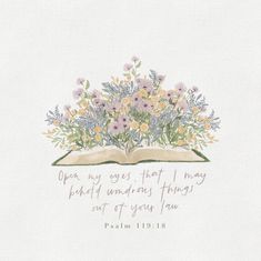 an open book with flowers and bible verse