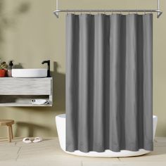 a gray shower curtain in a bathroom