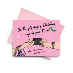 two greeting cards with hand holding camera on pink background