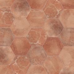 an image of a tile floor that looks like hexagonals in brown and tan