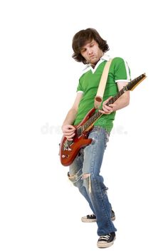 a young man holding an electric guitar and posing for the camera with his hands on his hips