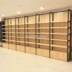 an empty room with wooden shelves in it