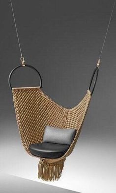 a chair that is hanging from a rope