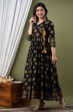 Material: Viscose Rayon Sizes: To Fit Bust(in inches): S(34), M(36), L(38), XL(40) Pattern: Ethnic Motifs Printed Wash Care: Dry Clean Style: Indo-Western Dress For Women, Indian Dress, Kurti, Fusion Dress Occasion: Party, Festive, Wedding Dispatch within 7 days Black Cutdana Anarkali Set With Straight Kurta, Black Straight Kurta Anarkali Set With Cutdana, Black Anarkali Dress With Cutdana Work, Black Cutdana Dress For Eid, Black Floor-length Kurta For Navratri, Bohemian Ankle-length Kurta For Navratri, Black Dresses With Printed Motifs For Festive Season, Festive Black Dress With Printed Motifs, Black Block Print Traditional Wear For Diwali