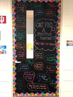 a classroom door decorated with writing on it