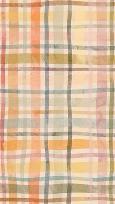 an orange, yellow and green plaid pattern on white paper with watercolor paint stains