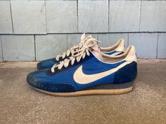 --  Vintage 1980s Nike Oceania Dark Blue Sneakers  --  Good overall condition with some wear and staining --  Made in Taiwan --  Dated 1981 --  Stamped size 9.5 --  Soles are very stiff --  Sold as is and for display only --  Size Men's size 9 1/2, but please see below for exact measurements --  Thanks for looking and be sure to check out my other items! MEASUREMENTS Height (From Top to Bottom of Heel) - 4 1/8 inches Width (At Widest Point) - 3  7/8 inches Length (From Toe to Back of Boot) - 11 3/8 inches Blue Sneakers, Tie Shoes, Tennis Shoes, Athletic Shoes, Dark Blue, Shoes Sneakers, Lace Up, Electronic Accessories, Nike