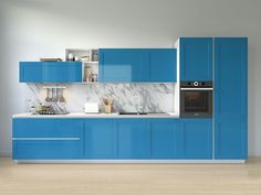 a modern kitchen with blue cabinets and marble counter tops, along with an oven in the center