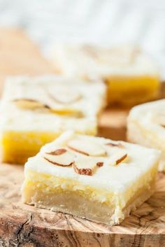 pieces of cake sitting on top of a wooden cutting board