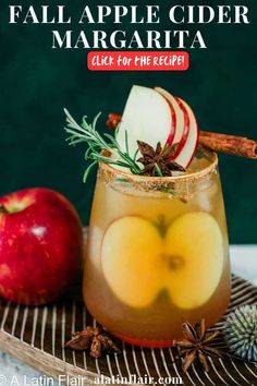 an apple cider margarita is garnished with cinnamon and apples