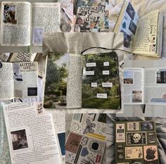 an assortment of books and papers spread out on a bed