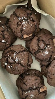 chocolate cookies in a cardboard box with white sprinkles