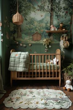 a baby's room decorated in green and white with a forest mural on the wall