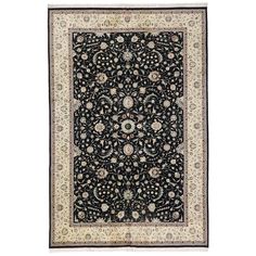 a black and white rug with an intricate design on the center, surrounded by flowers