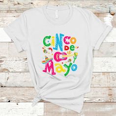 Funny Cinco De Mayo T Shirt Cinco De Mayo Mexican Fiesta 5 De Mayo Latina Mexican PartyOur T-Shirts are custom-made to order and handcrafted to the highest quality standards. ----Product Details---- 5.3 oz., 100% preshrunk cotton. Taped shoulder-to-shoulder. Seamless rib at neck. Coverstitched collar and sleeves. Seamless rib at neck. Processing time: 4 - 7 business days. Shipping time: 3 - 5 business days. Made in the United States. ----Care Instruction---- Machine wash cold. Tumble dry medium. Do not bleach. ----Note---- Please refer to the SIZE CHART for accurate sizing, and allow a slight ±1 inch difference due to manual measurement. Colors may slightly vary due to different lighting conditions. The final product's design may slightly shift in position due to the manual cut and sew pro 5 De Mayo, Mexican Party, Digital Printing, Your Story, 1 Inch, Custom Made, Size Chart, United States, T Shirt