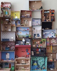 many boxes are stacked on top of each other with toys in them and one is empty